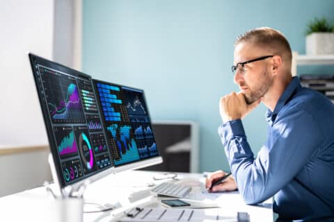digital marketing professional looking at marketing attribution data