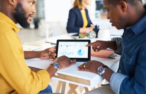 marketers analyzing A/B test for AI paid ads