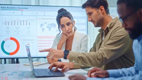 digital marketing team reviewing AI customer analytics