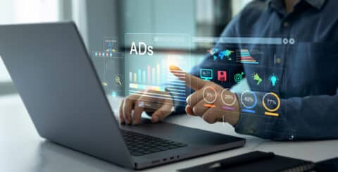 digital marketer reviewing attribution data for paid ads