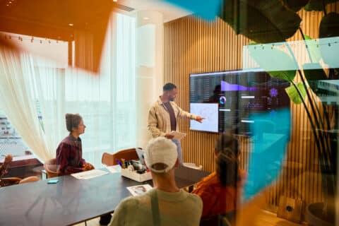 marketing professionals collaborating on a data-driven marketing strategy